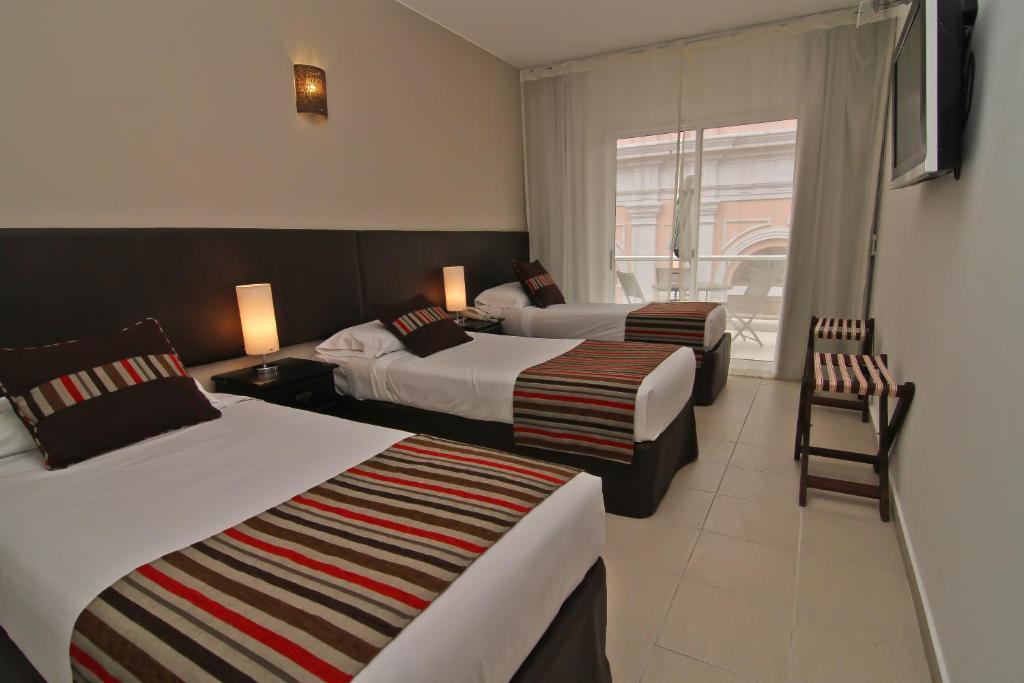 De la Plaza Hotel Maldonado Habitación foto