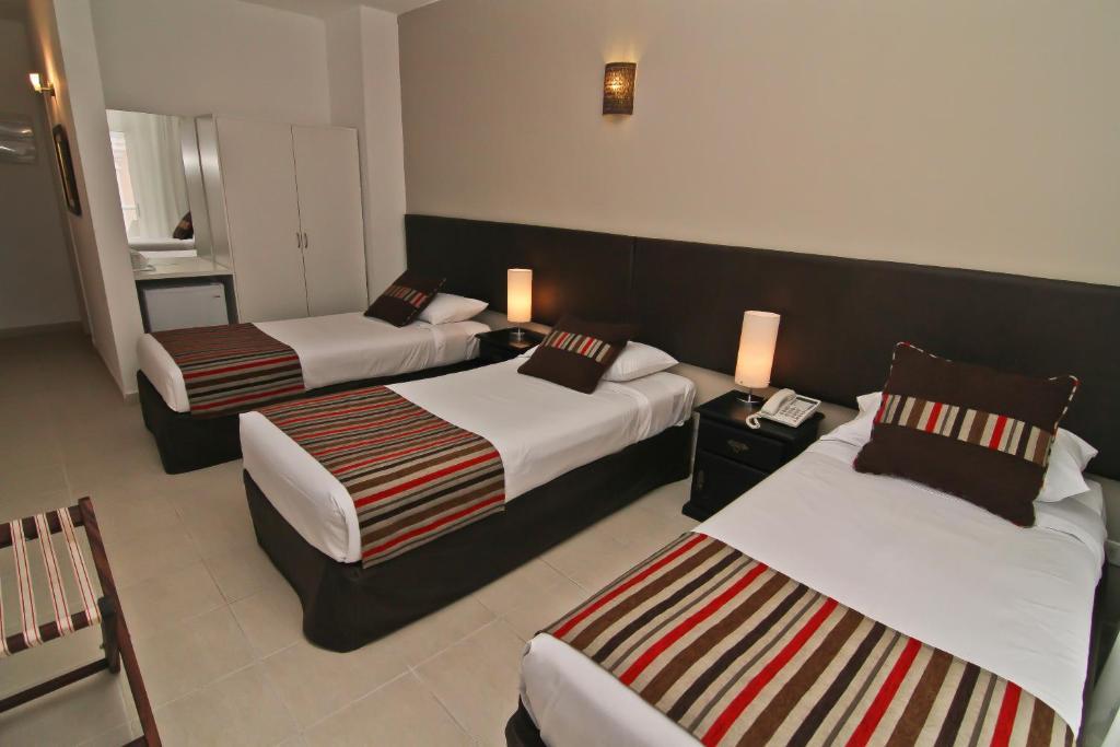 De la Plaza Hotel Maldonado Habitación foto